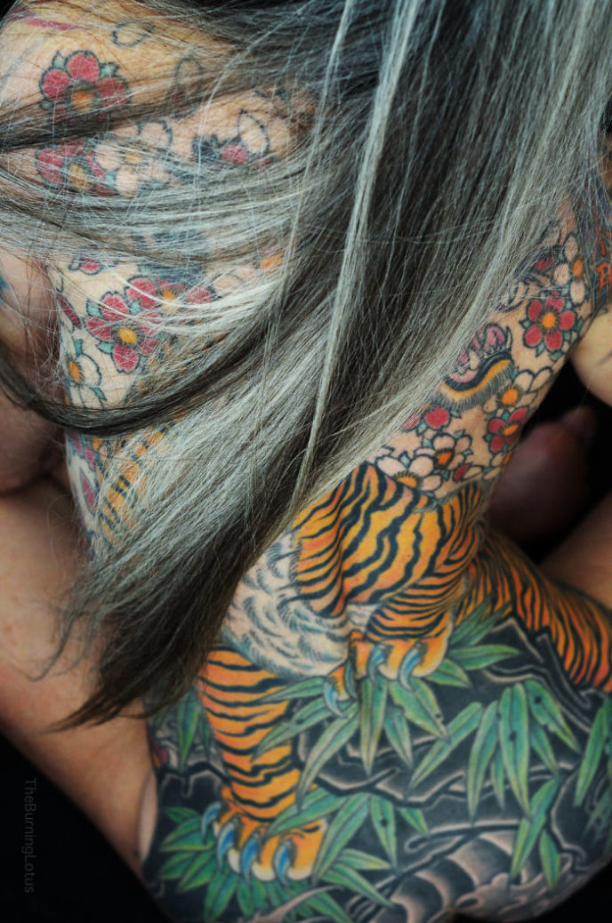 56 year woman body piercing tattoo julie burning lotus 7 58b3dc307df86 jpeg__700.jpg