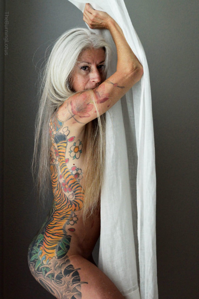 56 year woman body piercing tattoo julie burning lotus 8 58b3dc3390431 jpeg__700.jpg