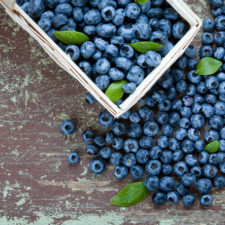 Ripe blueberries on table