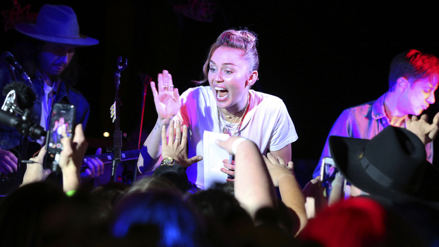 Miley Cyrus performs at a private concert at Tootsie's to celebrate the release of her album "Younger Now" on Friday, Sept. 29, 2017, in Nashville, Tenn. (Photo by Laura Roberts/Invision/AP)