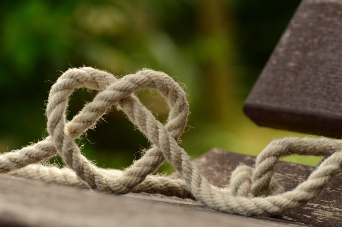 Https://www.pexels.com/photo/brown rope tangled and formed into heart shape on brown wooden rail 113737/