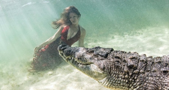 MODELS POSE WITH CROCODILES