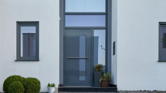 Facade,Of,A,Modern,House,With,A,Gray,Front,Door