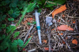 Used syringe on the ground.