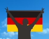 Maketa muža držiaca nemeckú vlajku