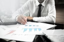 Businessman analyzing investment charts