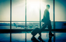 Silhouette of a man at the Airport with Suitcase