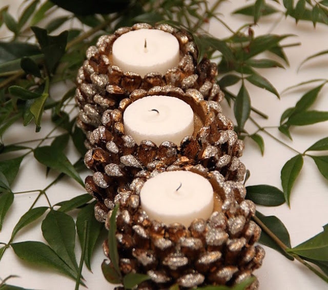 Shimmery pinecone candle holders with white tea lights.jpg