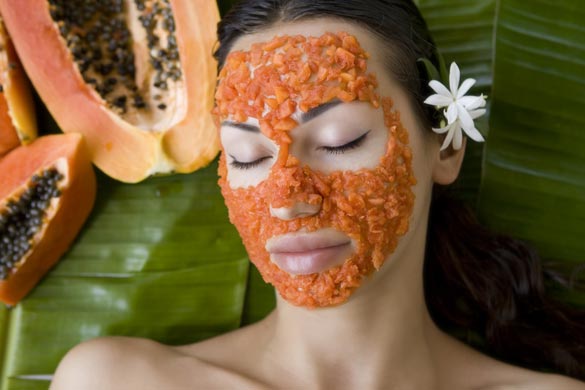 Beautiful caucasian woman having fresh papaya natural facial mask apply.jpg