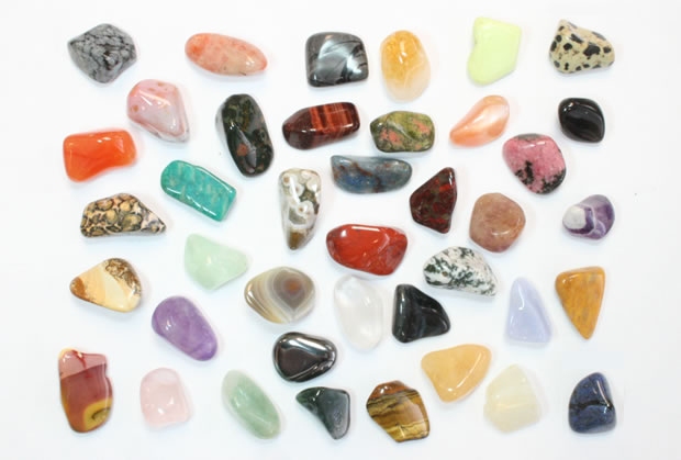 A group of assorted energy healing stones used in therapy.jpg