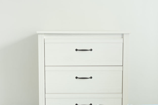 White modern chest drawers near white wall.jpg