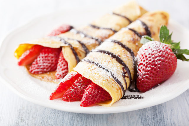 Pancakes with strawberry and chocolate sauce