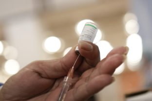 A healthcare worker prepares a dose of the Sinopharm COVID-19 vaccine during a vaccination campaign for third dose booster shots