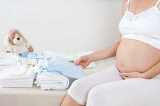 Pregnant woman is getting ready for the maternity hospital