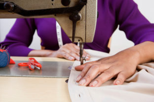 Woman using sewing machine