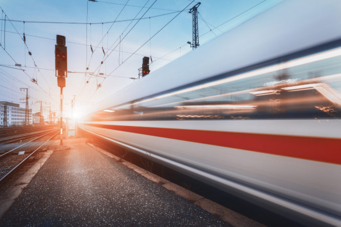 Modern high speed passenger train on railroad in motion