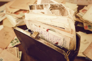 Old papers in the vintage handbag