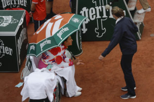 Victoria Azarenka of Belarus complains about the weather conditions and ask the umpire to suspend the first round match of the French Open tennis tournament against Montenegro's Danka Kovinic at the Roland Garros stadium in Paris.