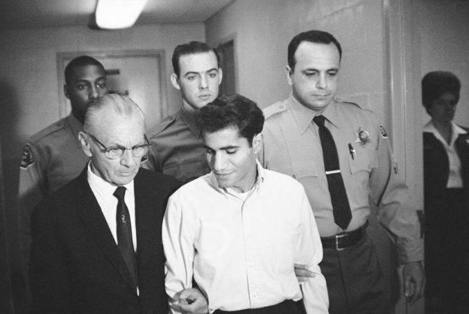 FILE - In this June 28, 1968, file photo, Sirhan Bishara Sirhan is escorted by his attorney, Russell E. Parsons from Los Angeles county jail chapel to enter plea to charge of murder in Los Angeles. U.S. Sen. Robert F. Kennedy's assassin was granted parole Friday, Aug. 27, 2021, after two of RFK's sons spoke in favor of Sirhan Sirhan’s release and prosecutors declined to argue he should be kept behind bars. ()