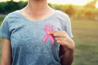 Woman holding pink ribbon breast cancer awareness. concept healthcare