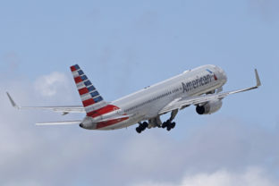 American Airlines In this June 3, 2016 file photo, an American Airlines passenger jet takes off from Miami International Airport in Miami. American Airlines says a passenger entered the open cockpit of a jet that was preparing to take off in Honduras, and he damaged the plane before crew members and police could stop him. American said Wednesday, Jan. 12, 2022 that the man was arrested. The flight, which was bound for Miami, was delayed several hours until American could fly a replacement plane into Honduras.
