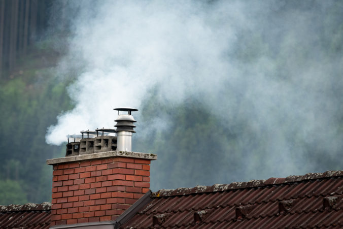 Smoke coming out of an old chimney