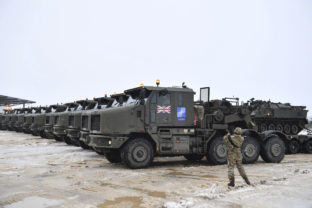 Estonia Ukraine Tanks uploaded on military truck platforms as a part of additional British troops and military equipment arrive at Estonia's NATO Battle Group base in Tapa, Estonia, Friday, Feb. 25, 2022. With Ukrainian President Volodymyr Zelenskyy appealing for help, NATO members ranging from Russia’s neighbor Estonia in the north down to Bulgaria on the Black Sea coast triggered urgent consultations about their security. Invasion