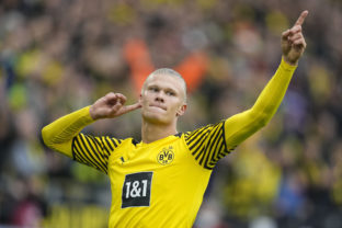 FILE - Dortmund's Erling Haaland celebrates after scoring a penalty during the German Bundesliga soccer match between Borussia Dortmund and FSV Mainz 05 in Dortmund, Germany, Saturday, Oct. 16, 2021. Erling Haaland looks sure to be coming home. The future of the Norway striker is set to be finalized this week and the expectation is he will leave Borussia Dortmund to join Manchester City as the English club’s belated replacement for Sergio Aguero. The 21-year-old Haaland is one of the rising stars of world soccer.