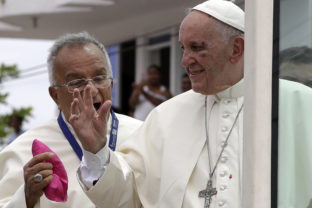 FILE - Small drops of blood stain Pope Francis' white cassock as he speaks with Jorge Enrique Jimenez Carvajal, emeritus archbishop of Cartagena after knocking his face next to his eye on the popemobile in Cartagena, Colombia, Sunday, Sept. 10, 2017. Pope Francis said Sunday, May 29, 2022 he has tapped 21 churchmen to become cardinals, most of them from continents other than Europe, which has dominated Catholic hierarchy for most of the church's history. (AP Photo/Andrew Medichini, File)