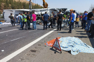 Emergency and rescue teams attend the scene after a bus crash accident on the highway between Gaziantep and Nizip, Turkey, Saturday, Aug. 20, 2022. Officials in southern Turkey say at least 15 people were killed when a passenger bus collided with emergency teams handling an earlier road accident