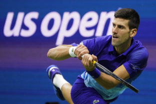 FILE - Novak Djokovic, of Serbia, returns a shot to Alexander Zverev, of Germany, during the semifinals of the U.S. Open tennis championships, Friday, Sept. 10, 2021, in New York. Djokovic will not play in the U.S. Open, as expected, because he is not vaccinated against COVID-19 and thus is not allowed to travel to the United States. Djokovic announced his withdrawal from the year’s last Grand Slam tournament on Twitter on Thursday, Aug. 25, 2022, hours before the draw for the event was revealed