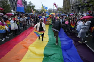 People take part in the European LGBTQ pride march in Belgrade, Serbia, Saturday, Sept. 17, 2022. Serbian police have banned Saturday's parade, citing a risk of clashes with far-right activists