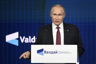 Russian President Vladimir Putin speaks as he arrives at the plenary session of the 19th annual meeting of the Valdai International Discussion Club outside Moscow, Russia