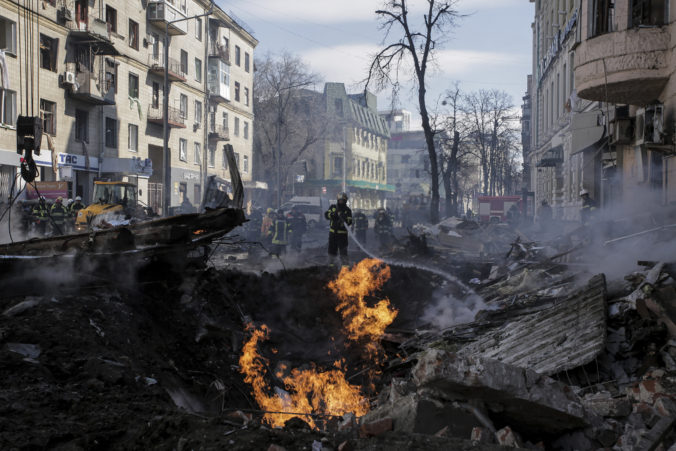 APTOPIX Russia Firefighters extinguish flames outside an apartment house after a Russian rocket attack in Kharkiv, Ukraine's second largest city Ukraine War