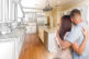 Young,Military,Couple,Looking,Inside,Custom,Kitchen,And,Design,Drawing