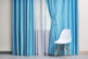Chair,And,Room,Window,With,White,And,Blue,Curtains
