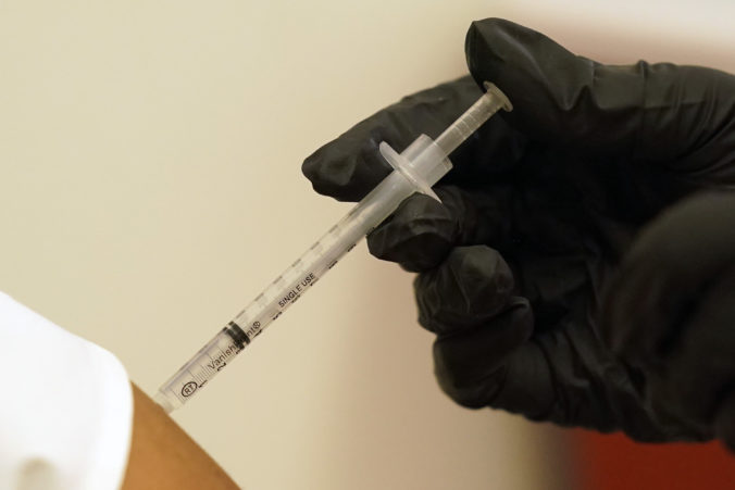 Virus Outbreak Texas A woman is injected with her second dose of the Pfizer COVID 19 vaccine at a Dallas County Health and Human Services vaccination site in Dallas, Thursday, Aug. 26, 2021.