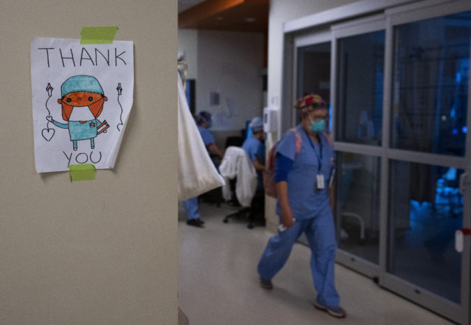 Virus Outbreak Canada A health care worker walks past a thank you sign in the intensive care unit at the Humber River Hospital during the COVID 19 pandemic in Toronto