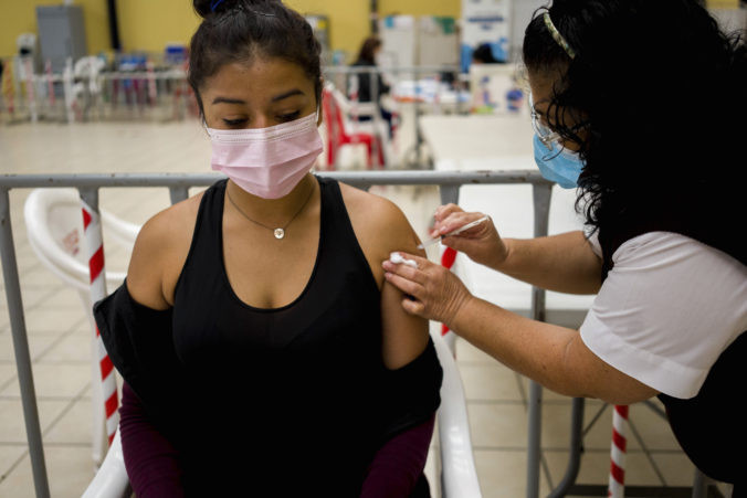 Virus A healthcare worker administers an AstraZeneca booster shot for COVID 19 at a vaccination center in Guatemala City Outbreak Guatemala